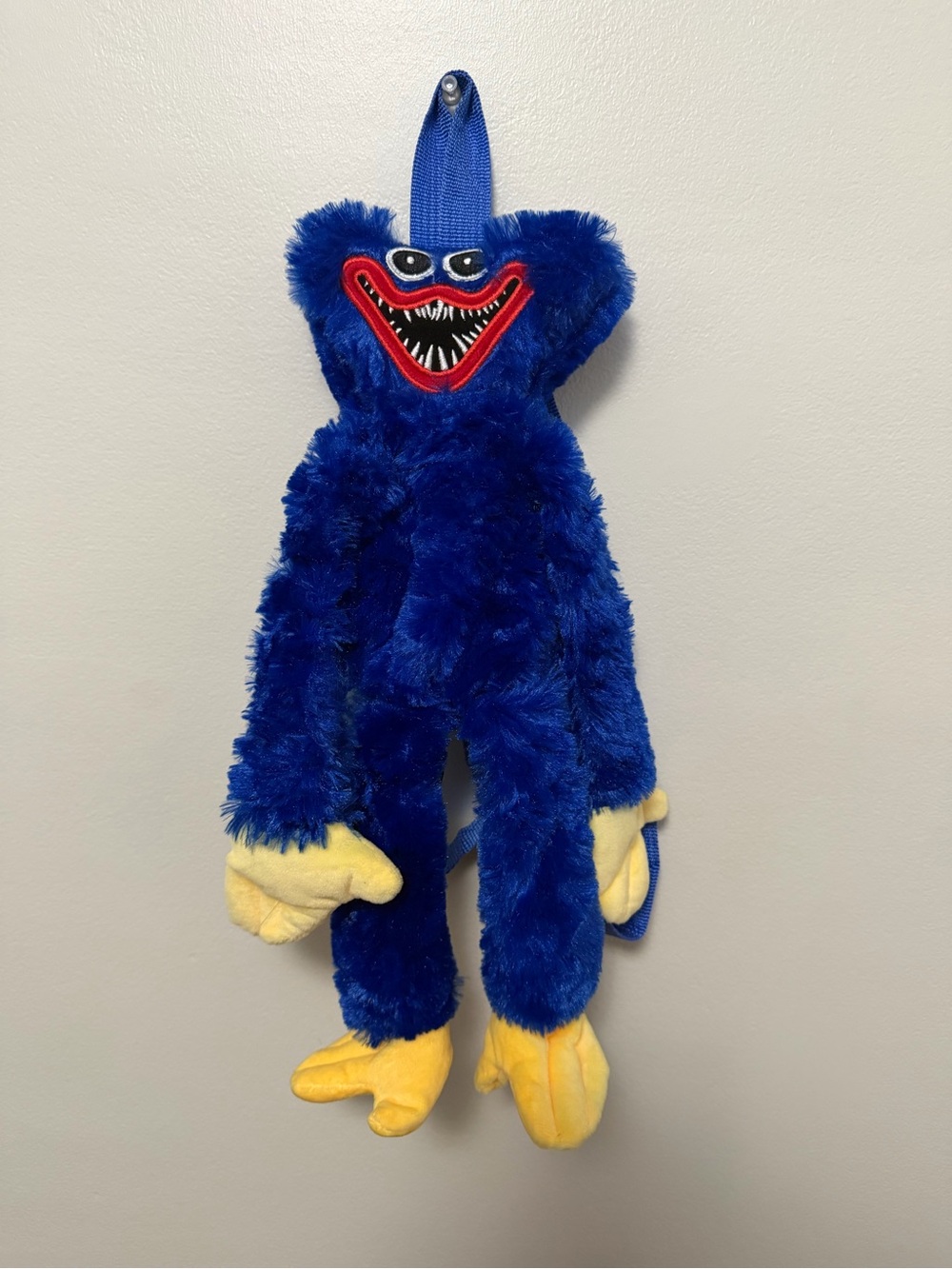 Plush Blue Character Toy with Yellow Hands & Feet